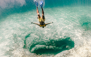 Jump and immerse into the beautiful caribbean water
